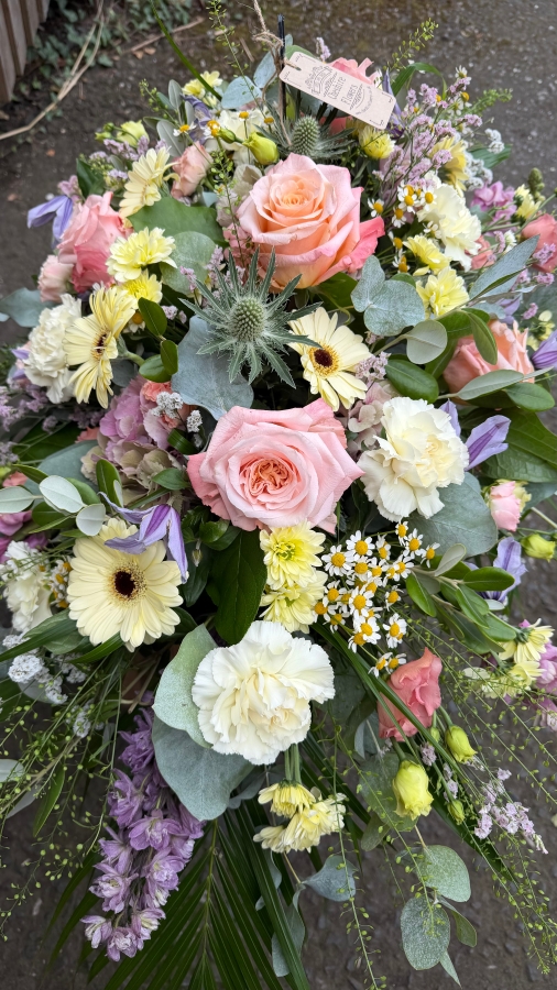 Pastel casket spray 